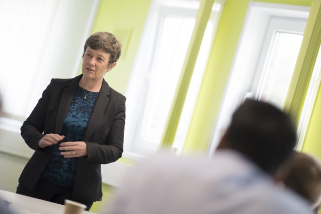 Woman presenting to meeting