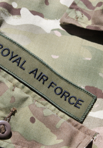 Close up of the Royal Air Force badge on a UK military camouflage uniform symbolising the UK military, RAF and the centenary of the First World War