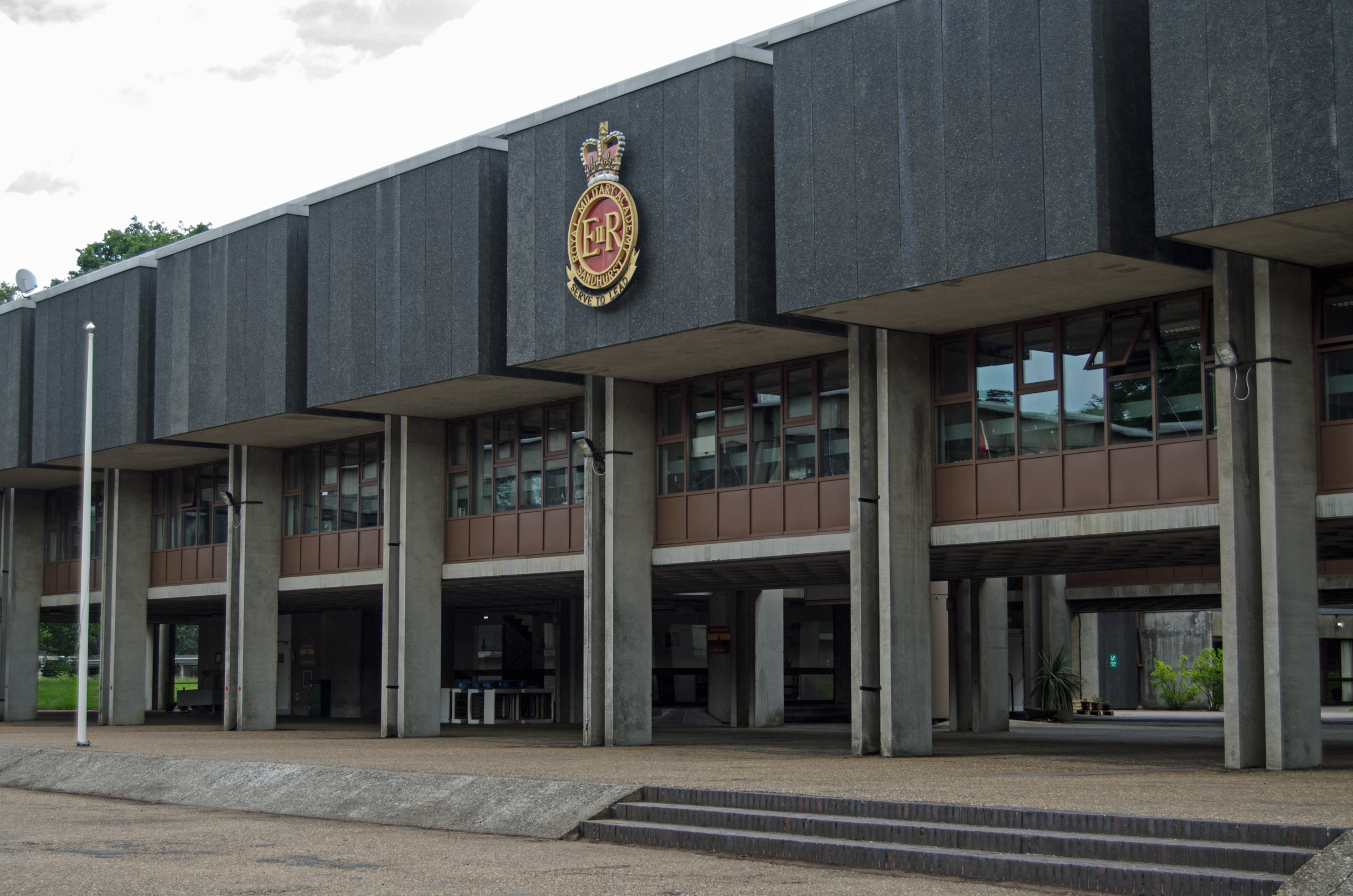 Sandhurst, Berkshire, UK - June 16, 2019: Exterior of the brutalist Victory Building builtin 1970 at the Royal Military Academy in Sandhurst, Berkshire. Officers for the British Army are trained here.